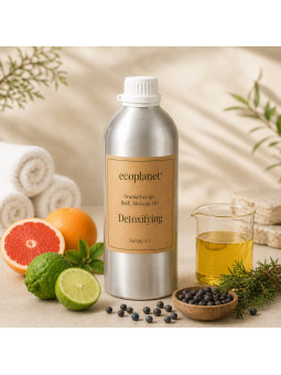 EcoPlanet® Detoxifying Body Massage Oil displayed in a calm spa setting with citrus fruits, juniper berries and natural herbs.
