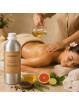 EcoPlanet® Detoxifying Aromatherapy Massage Oil being poured during a relaxing spa body massage treatment.