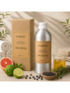 EcoPlanet® Detoxifying Aromatherapy Body Massage Oil 1 L bottle with carton pack, citrus fruits, herbs and spa accessories.